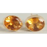 A PAIR OF YELLOW GOLD CITRINE STUDS.