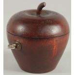 A WOODEN APPLE TEA CADDY. 4.5ins high.