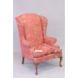 A PINK WING ARM CHAIR with tapestry cover with wild animals, on cabriole legs.