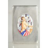 AN ENGINE TURNED SILVER CIGARETTE CASE with an oval of a glamour model. 5ins x 3.25ins.