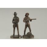 A GOOD SMALL PAIR OF BRONZE COWBOYS, inscribed. 6ins.