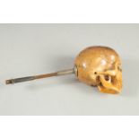 A RARE POSSIBLY 18TH CENTURY CARVED AND INSCRIBED SKULL PIPE. Skull 1.75ins long, 1.75ins wide, 1.