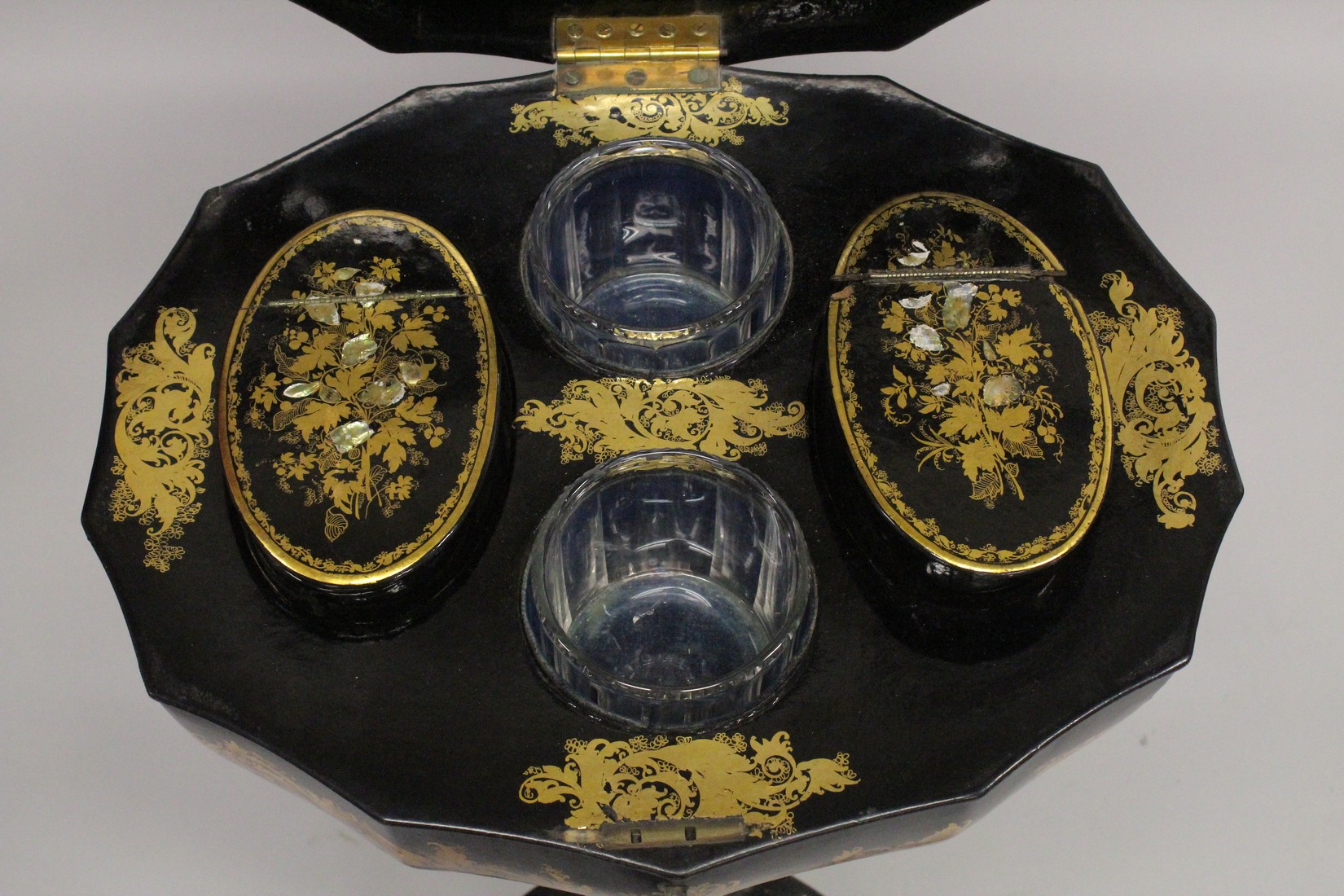 A VICTORIAN PAPIER MACHE TEA POUY ON A TRIPOD BASE, inlaid with mother of pearl and decorated in - Image 3 of 7