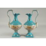 A PAIR OF SEVRES DESIGN PORCELAIN JUGS with a band of cupids. 13ins high.