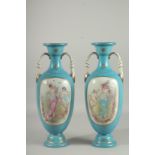 A PAIR OF SEVRES DESIGN LIGHT BLUE TWO HANDLED VASES with oval classical scenes. 18ins high.