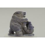 A GOOD PAIR OF CARVED LAPIS BEARS on a shaped base. 6ins high.