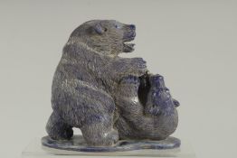 A GOOD PAIR OF CARVED LAPIS BEARS on a shaped base. 6ins high.