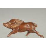 A CARVED WOOD BOAR NETSUKE. Signed.