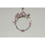 AN ART DECO DESIGN SILVER AND RUBY SET PANETHER LOUPE AND CHAIN.