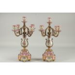 A PAIR OF SEVRES DESIGN FIVE LIGHT CANDLESTICKS with scrolling branches. 16ins high.