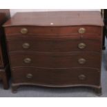 A GOOD GEORGE III MAHOGANY SERPENTINE FRONTED COMMODE with four long graduated drawers with brass