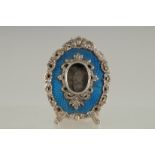 A GOOD FABERGE SILVER AND BLUE ENAMEL EASLE FRAME, in an old Faberge box. 2.75ins x 2ins.