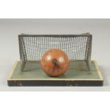 A RARE PIECE OF FOOTBALL MEMORABILIA, a goal with a football. 2.75ins diameter as a clock. Goal