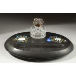 A DERBYSHIRE ASHFORD OVAL BLACK MARBLE INKSTAND with cut glass bottle, the stnad with pen well and