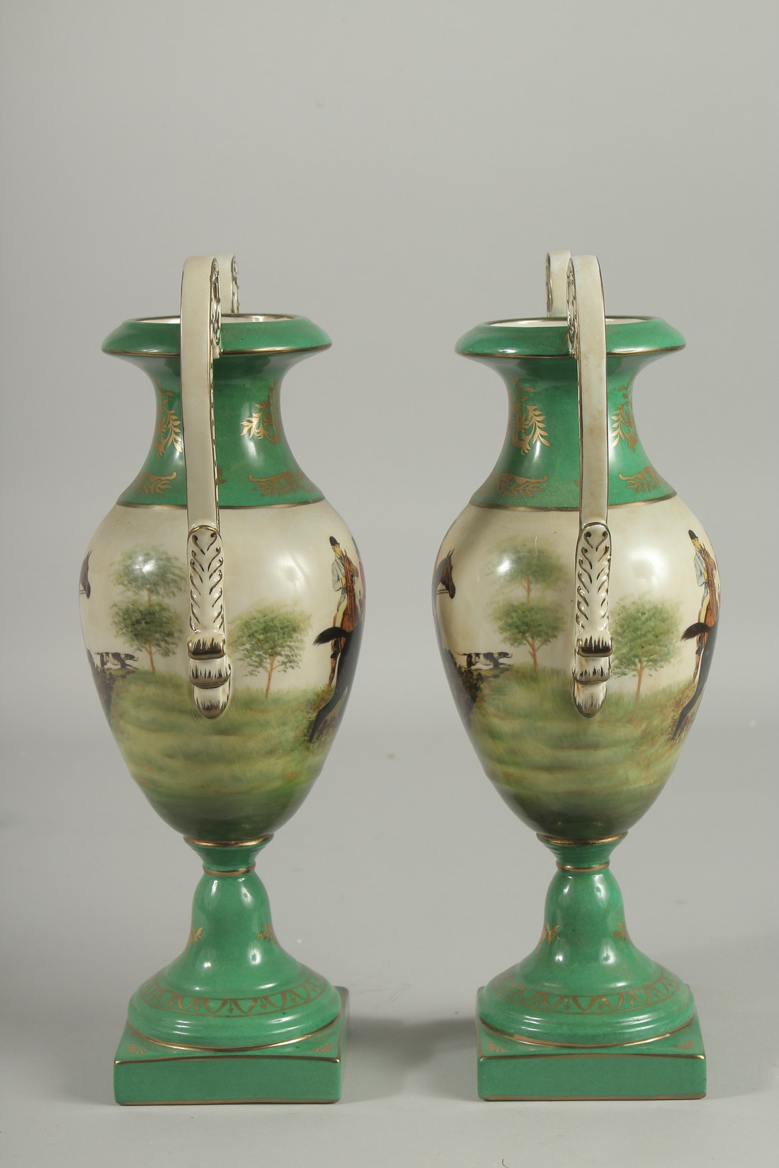 A PAIR OF SEVRES DESIGN TWO HANDLED GREEN HUNTING VASES. 13ins high. - Image 2 of 3