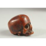 A RARE POSSIBLY 17TH CENTURY CARVED BONE SKULL. 2.25ins long, 1.5ins wide, 1.5ins high.