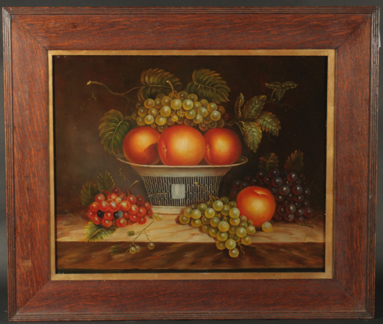 20th Century, A still life of apples and grapes on a ledge, oil on panel, 16" x 20", (40.5x51cm).