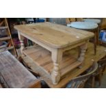 A pine two tier coffee table.