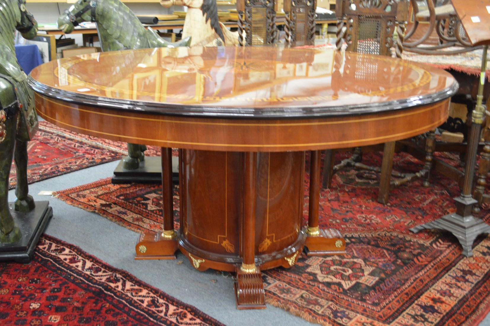 A good large and impressive classical design circular mahogany centre table with star burst