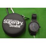 A Superdry Gents chronograph style wrist watch with original case.