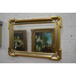 A decorative wall mirror with moulded rectangular frame.
