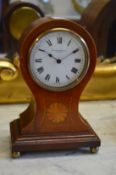 An Edwardian inlaid mahogany balloon shaped mantle clock, the enamel dial signed Sir John Bennett