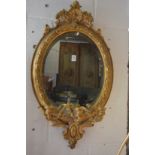 A good 19th century gilt framed oval three branch girandole.