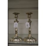 A pair of silver plated candlesticks.