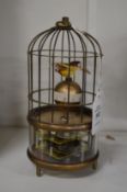 A bird cage clock.