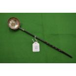 A coin inset silver toddy ladle.