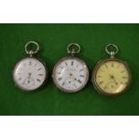 Two silver cased pocket watches and a plated pocket watch.