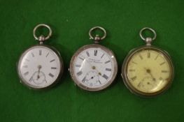 Two silver cased pocket watches and a plated pocket watch.