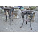 Two cast iron circular pub table bases.