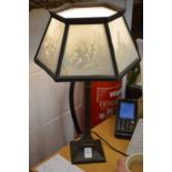 An unusual table lamp, the shade made with porcelain lithophane.