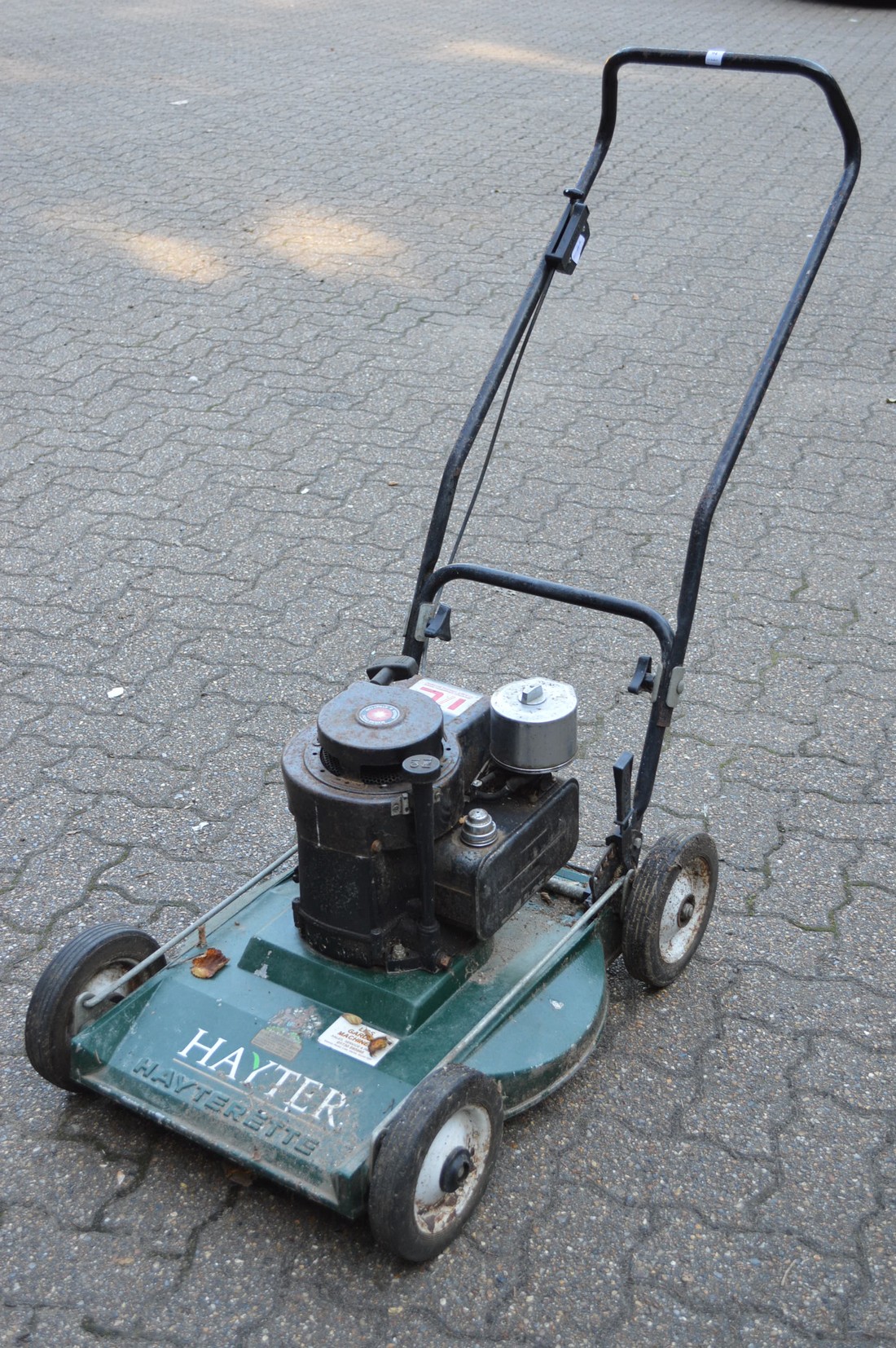 A Hayter Hayterette petrol rotary lawn mower.