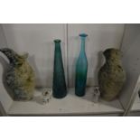 Stylish pottery vases, cat ornaments and glass bottles.