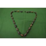 A rhino bead necklace.