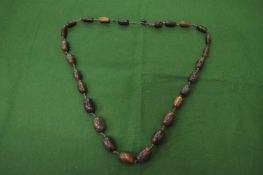 A rhino bead necklace.