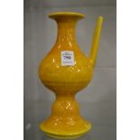 A Chinese yellow glazed pedestal ewer.