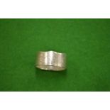 A Commonwealth 50p piece coin ring size Y½.