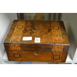 A Victorian walnut sewing box.