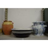 A large blue and white glazed twin handled earthenware pot, terracotta jar and other items.