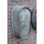 A large galvanised twin handled tub or planter.