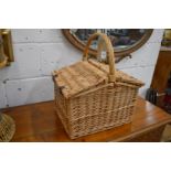 A wicker picnic basket.