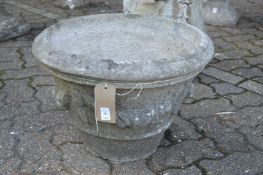 A pair of composite garden circular planters with swag decoration.