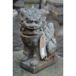 Two Chinese style lion dog garden ornaments.
