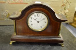 A small Edwardian inlaid mahogany mantle clock, the enamel dial signed Harrods Ltd.