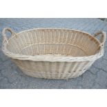 A large wicker twin handled basket.