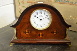 An inlaid mahogany dome topped mantle clock, the enamel dial signed Dyson clock maker to the King.