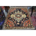 A good small Persian rug or mat 70cm x 58cm.